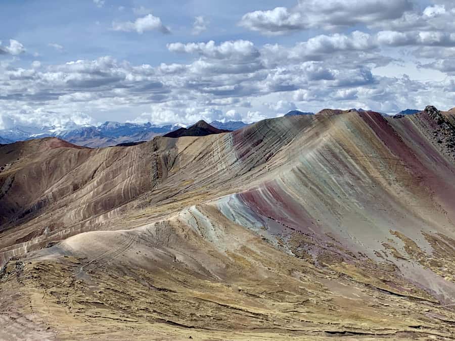 From Cusco: Full day Palcoyo Rainbow Mountain Tour - Palcoyo’s three striped peaks