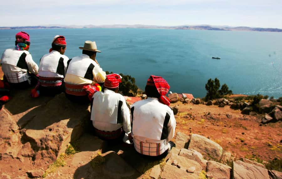 From Cusco: Uros Excursion to Uros Island - Taquile + Lunch. - Reaching the Uros Islands by boat