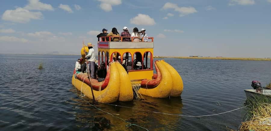 From Puno: full day tour to Uros and Taquile with Lunch - Starting in central Puno and reaching the port
