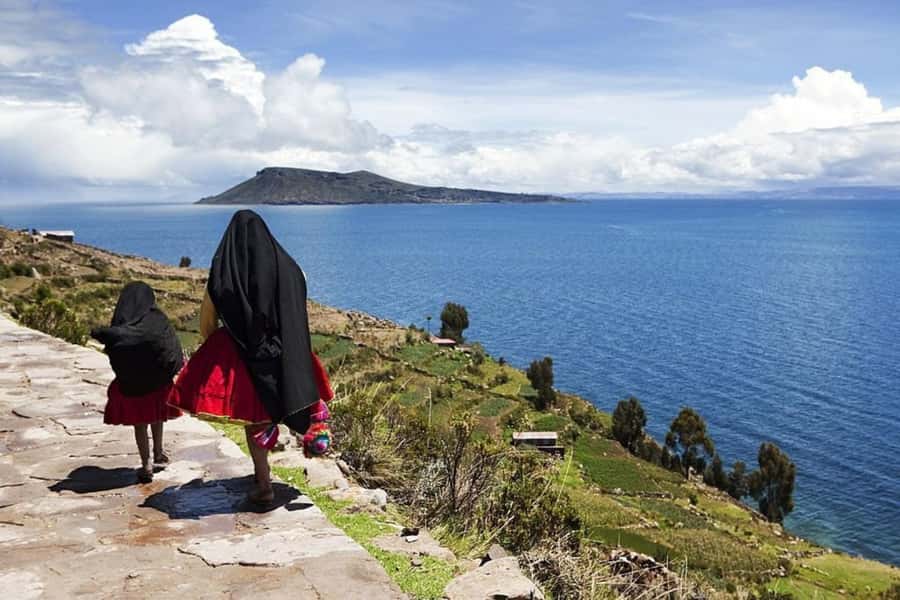 From Puno: Uros and Taquile Islands Full-Day Tour - Walking onto the Uros floating islands