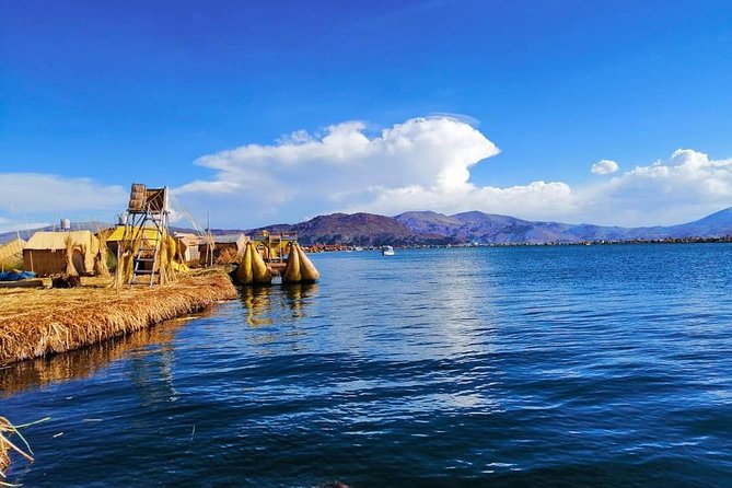 Full-Day Tour of Uros, Taquile and Sillustani from Puno - Walking onto the floating islands of Uros