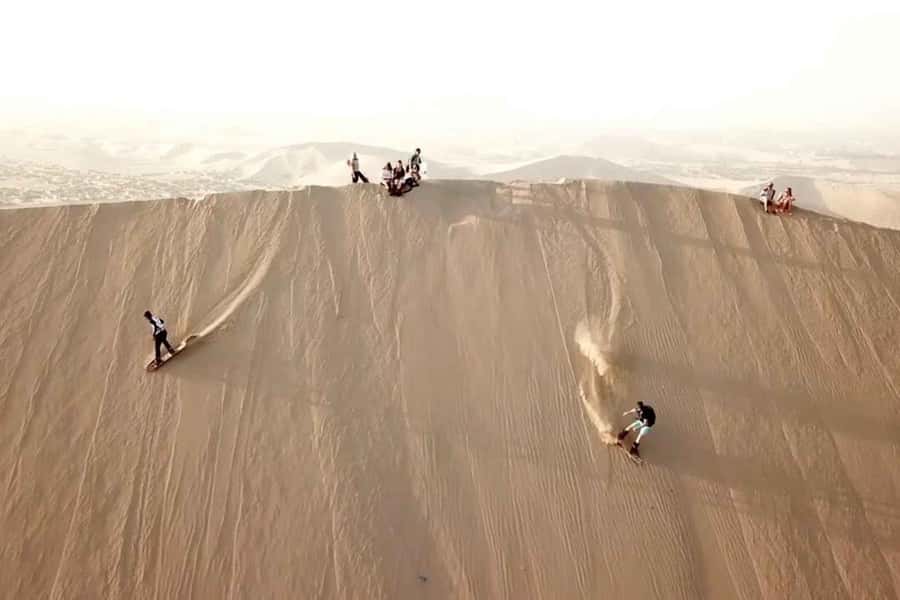 Nasca: Ocongalla Aqueduct Sandboarding in the Usaka desert - A sobering stop at the profaned cemetery