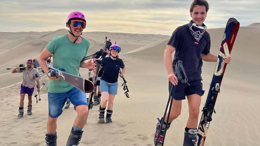 Pro Sanboarding or skiing in Huacachina from Lima - Day trip - Sunset above the oasis